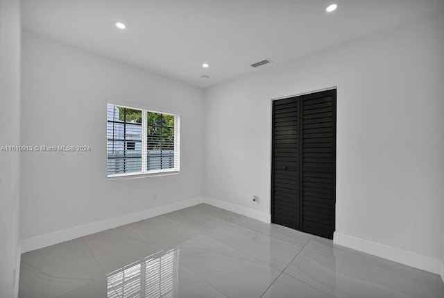 unfurnished bedroom featuring light tile patterned floors