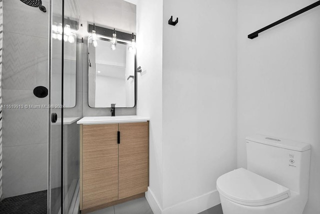 bathroom with tile patterned flooring, a shower with door, toilet, and vanity