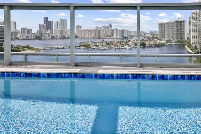 pool featuring a water view and a view of city