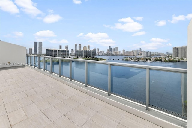 view of swimming pool featuring a water view and a city view