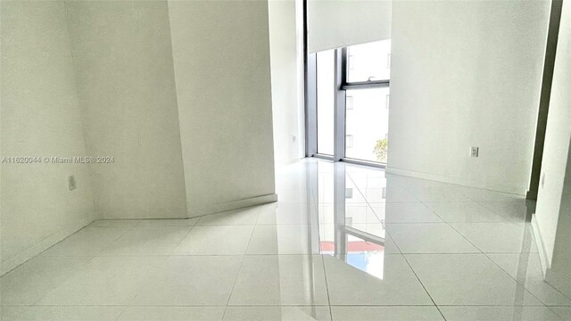 empty room with light tile patterned floors