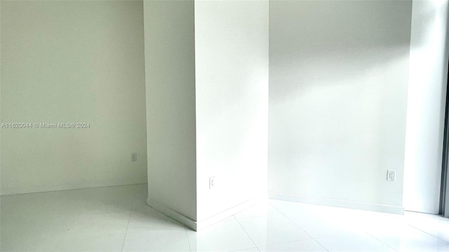 empty room with light tile patterned floors