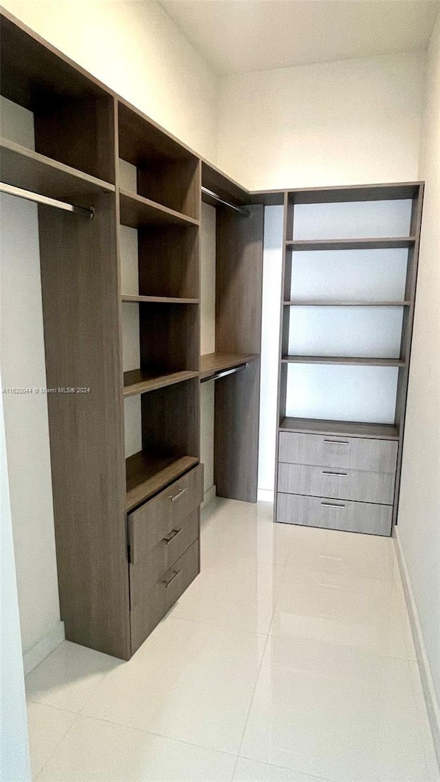 walk in closet featuring light tile patterned floors