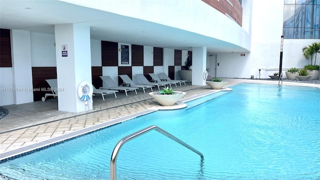 view of swimming pool with a patio