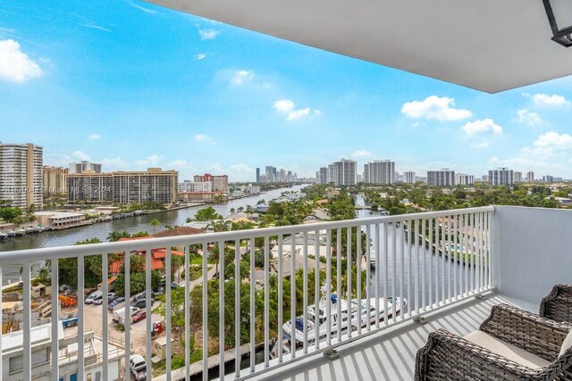 balcony featuring a water view