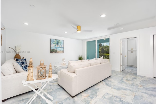 living room featuring ceiling fan and light tile patterned floors