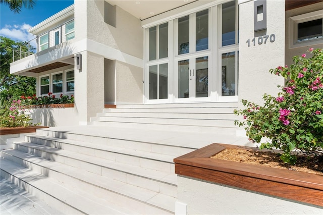 entrance to property with a balcony