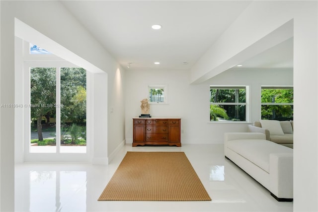 interior space featuring light tile patterned floors and a healthy amount of sunlight