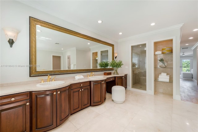 bathroom featuring vanity, ornamental molding, and walk in shower