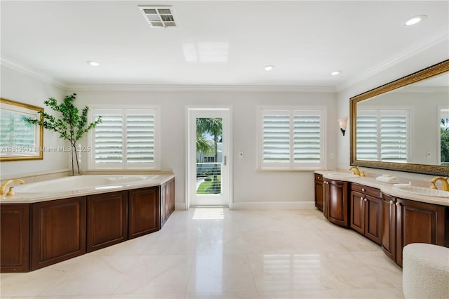 bathroom with a tub to relax in, vanity, and ornamental molding