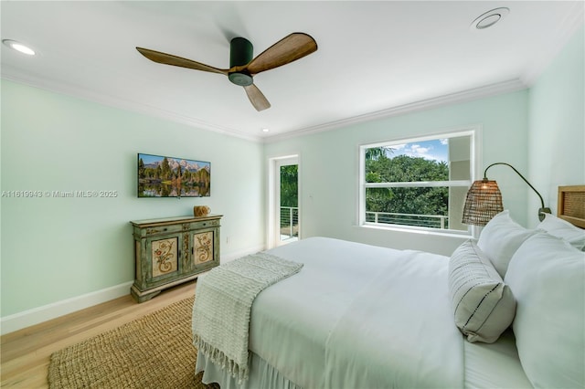 bedroom with ceiling fan, ornamental molding, and light wood-type flooring