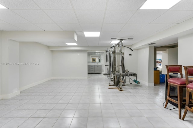 workout room with a drop ceiling