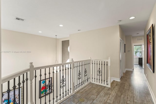 corridor with dark wood-type flooring