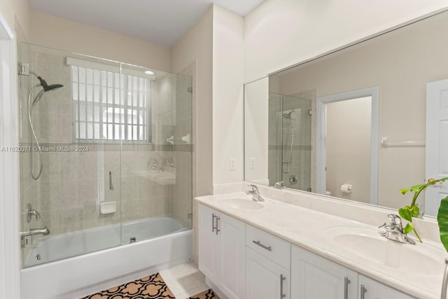 bathroom with tile patterned floors, enclosed tub / shower combo, and dual bowl vanity