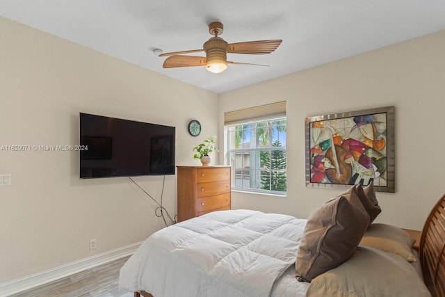 bedroom featuring hardwood / wood-style flooring and ceiling fan