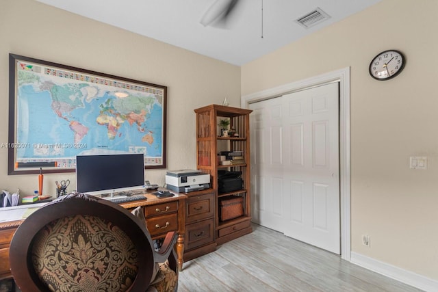 office area with ceiling fan and light hardwood / wood-style floors