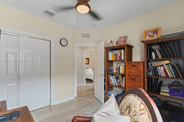 office space featuring light hardwood / wood-style flooring and ceiling fan