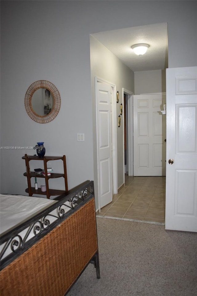 bedroom featuring light colored carpet