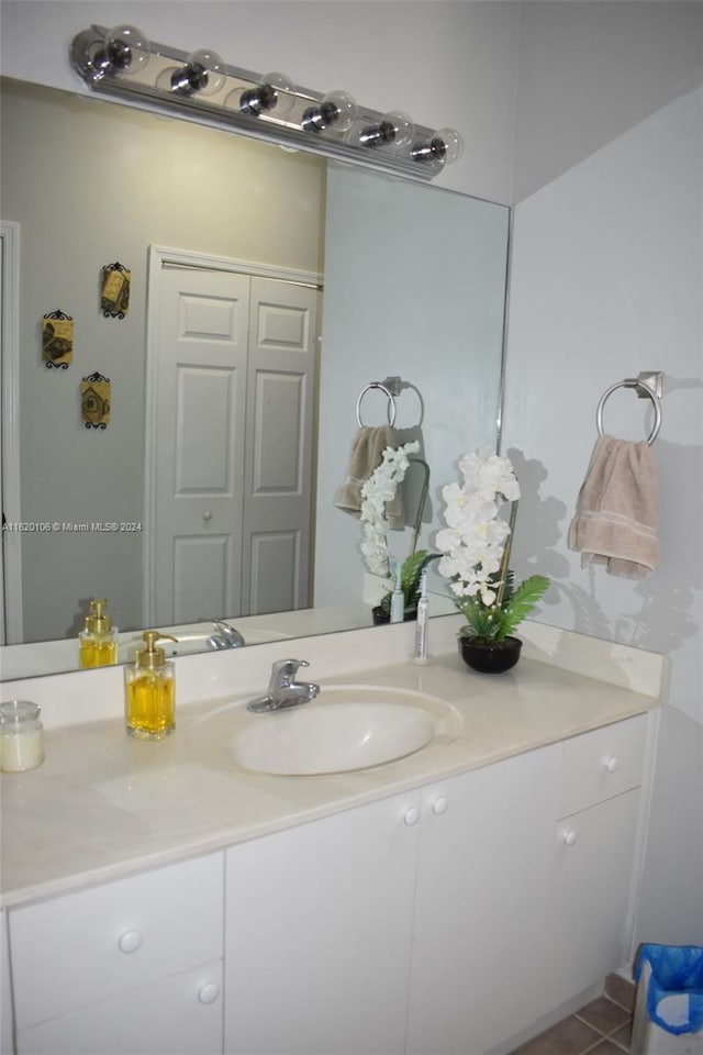 bathroom with vanity and tile patterned floors