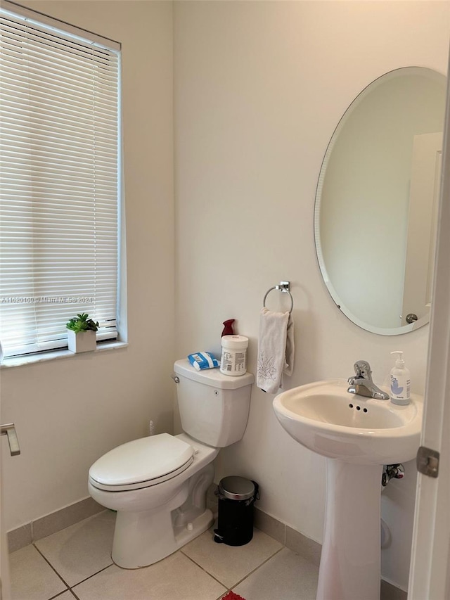 bathroom featuring tile patterned flooring and toilet