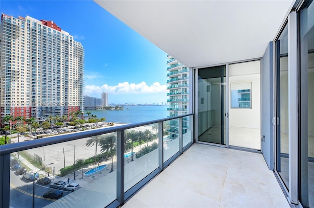 balcony featuring a water view