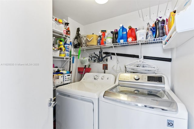 laundry area featuring washing machine and clothes dryer