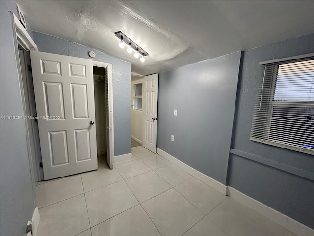 interior space featuring light tile patterned floors