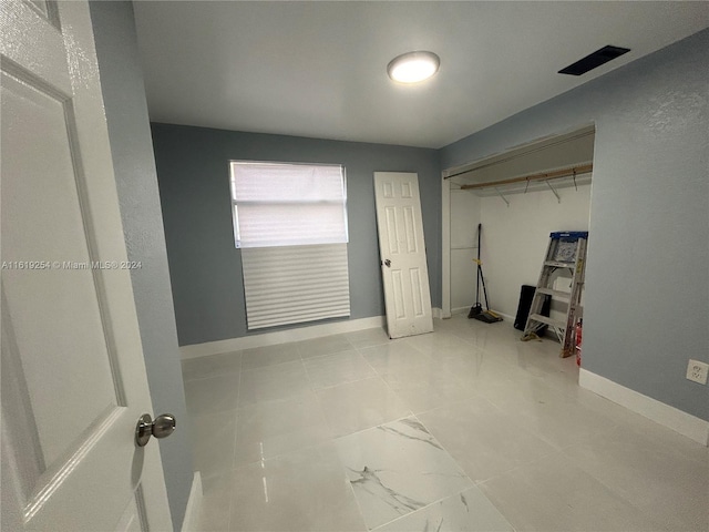 unfurnished bedroom featuring a closet