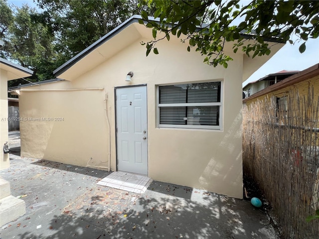 doorway to property with a patio