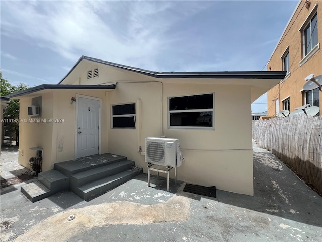 view of front of home featuring ac unit