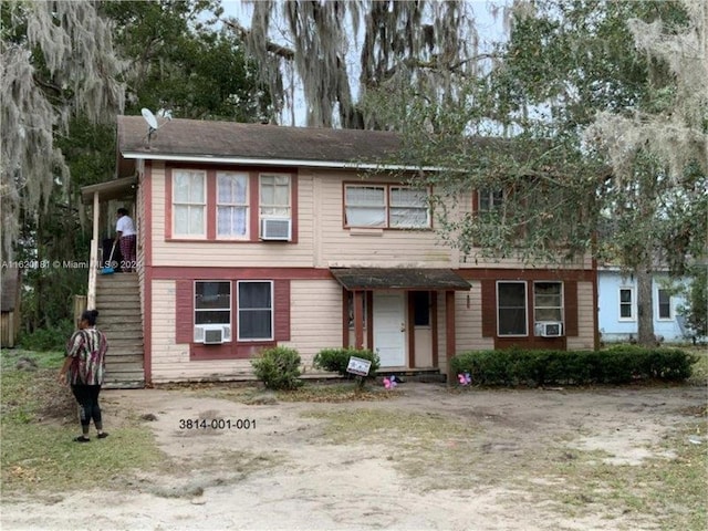 view of front of home featuring cooling unit