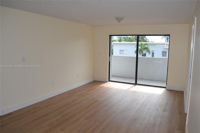 spare room with light wood-type flooring