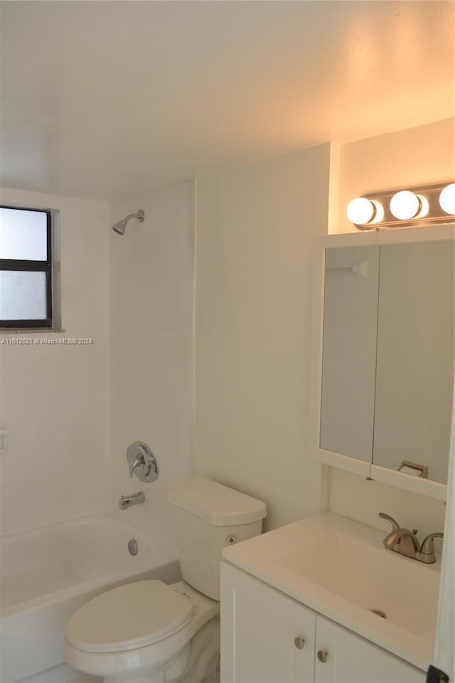 full bathroom with vanity, tub / shower combination, and toilet