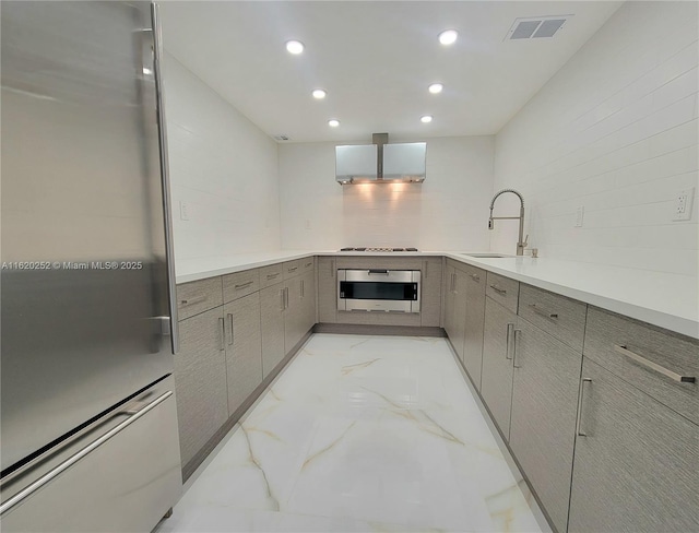 kitchen with sink, wall oven, stainless steel fridge, stovetop, and decorative backsplash