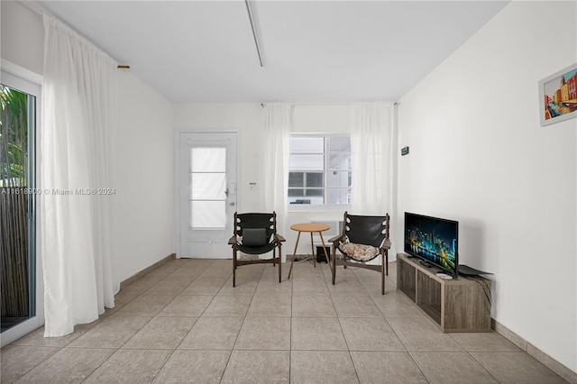 living area with light tile patterned floors