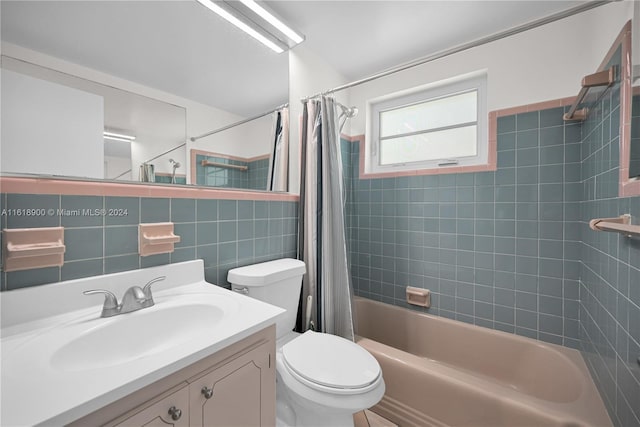 full bathroom with decorative backsplash, shower / bath combination with curtain, vanity, tile walls, and toilet