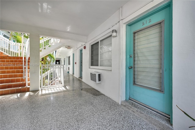 property entrance featuring a wall unit AC