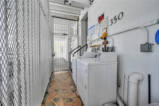 laundry area with independent washer and dryer