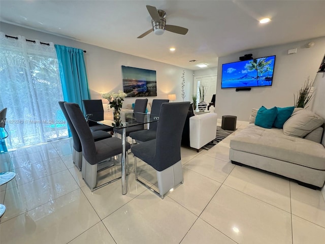 tiled living room featuring ceiling fan