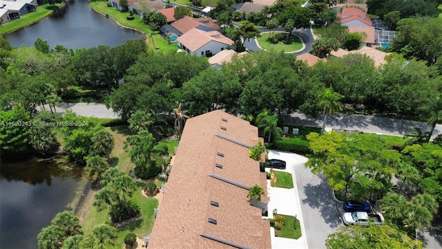 birds eye view of property with a water view