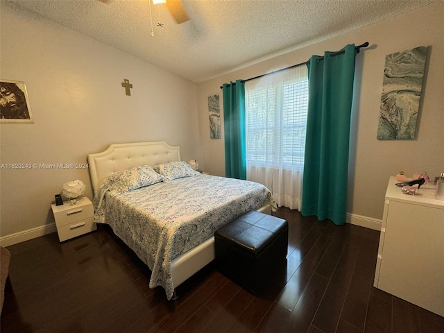 bedroom featuring ceiling fan, a textured ceiling, and wood-type flooring