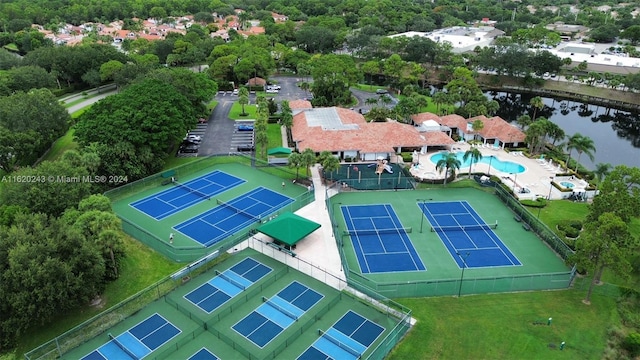 birds eye view of property with a water view