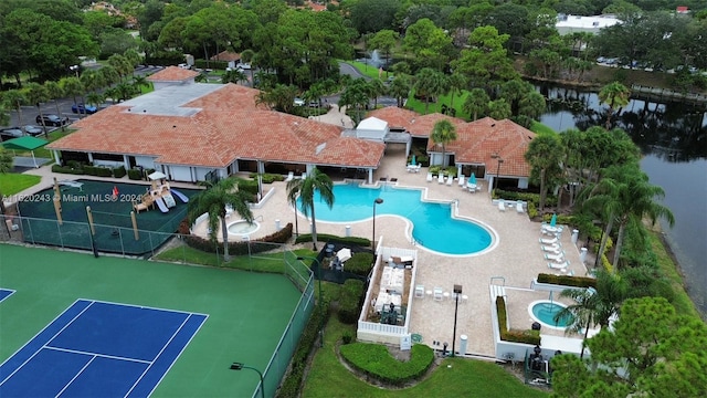 birds eye view of property with a water view