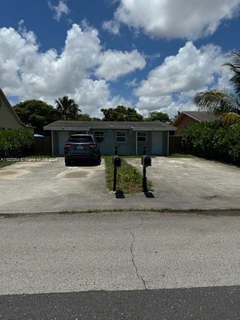 single story home featuring a garage