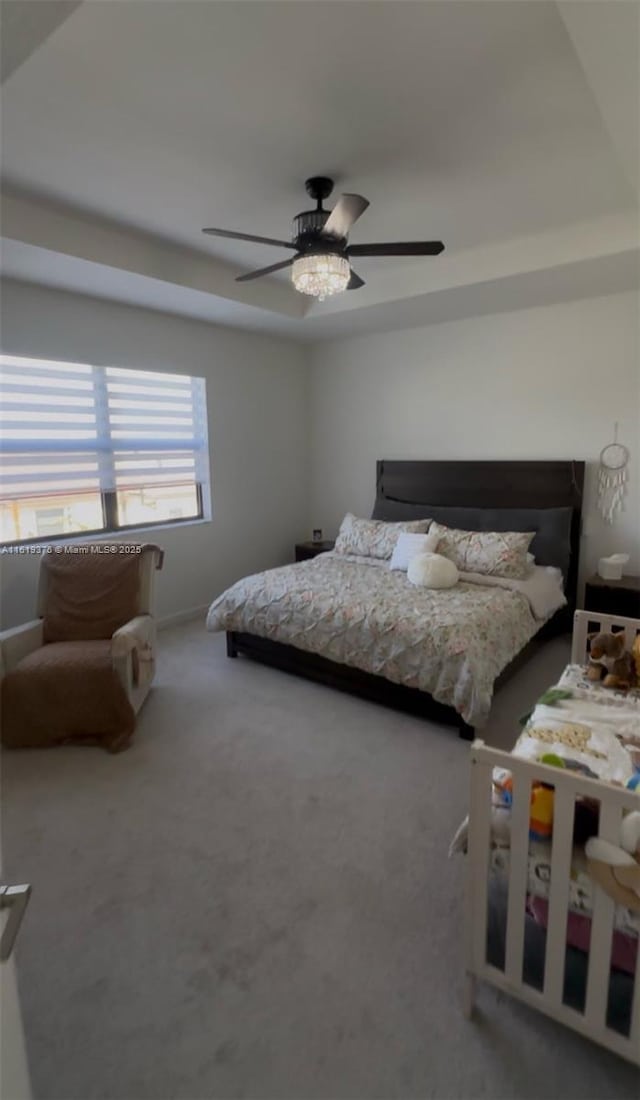 bedroom featuring ceiling fan and carpet floors