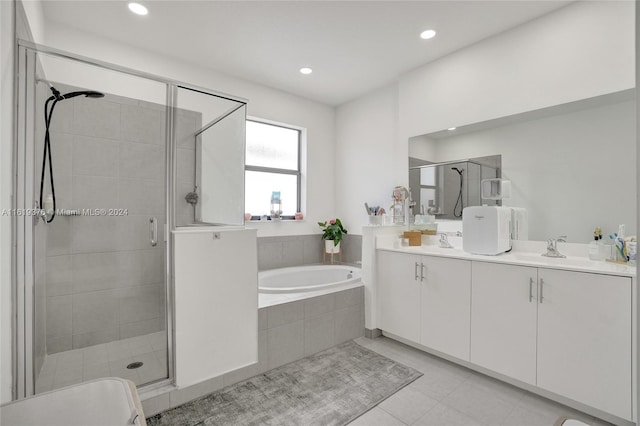 bathroom with vanity, shower with separate bathtub, and tile patterned floors