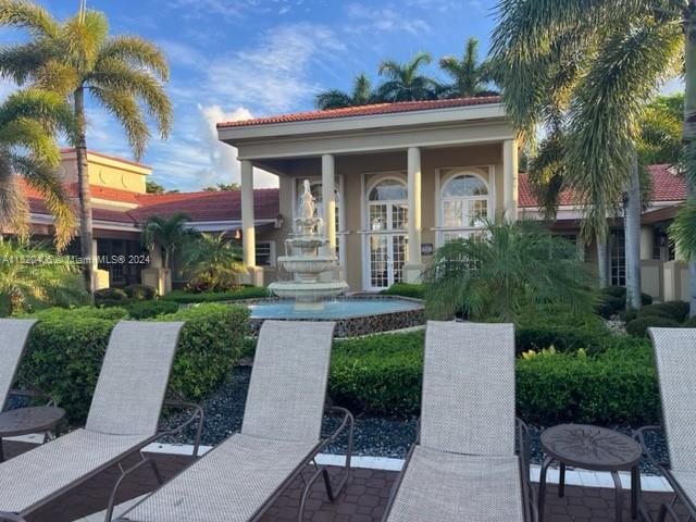 view of front of home with a patio and french doors