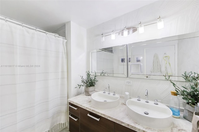 bathroom featuring decorative backsplash and double sink vanity