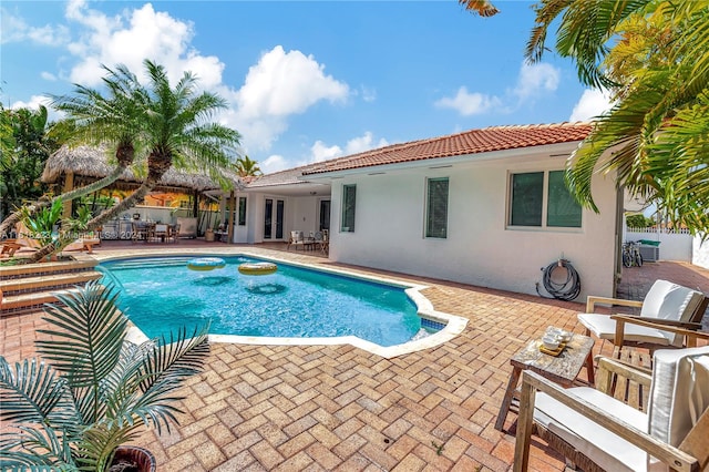 view of swimming pool featuring a patio area