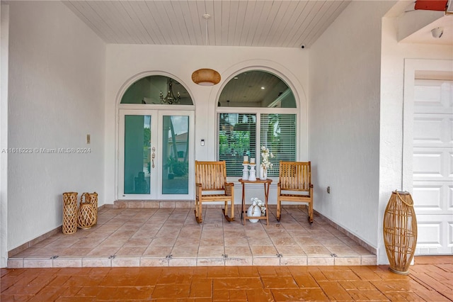 view of exterior entry featuring french doors